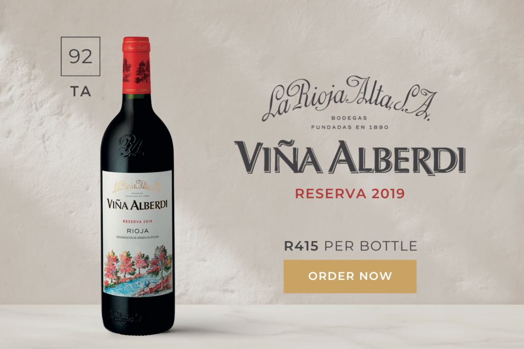 An ad featuring a bottle of Viña Alberdi Reserva 2019 wine with pricing and "Order Now" button.