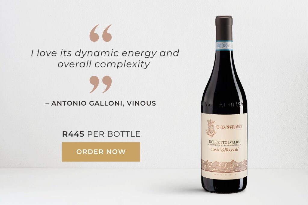 Bottle of G.D. Vajra Dolcetto D'Alba wine with a testimonial by Antonio Galloni praising its dynamic energy and complexity, priced at R445.