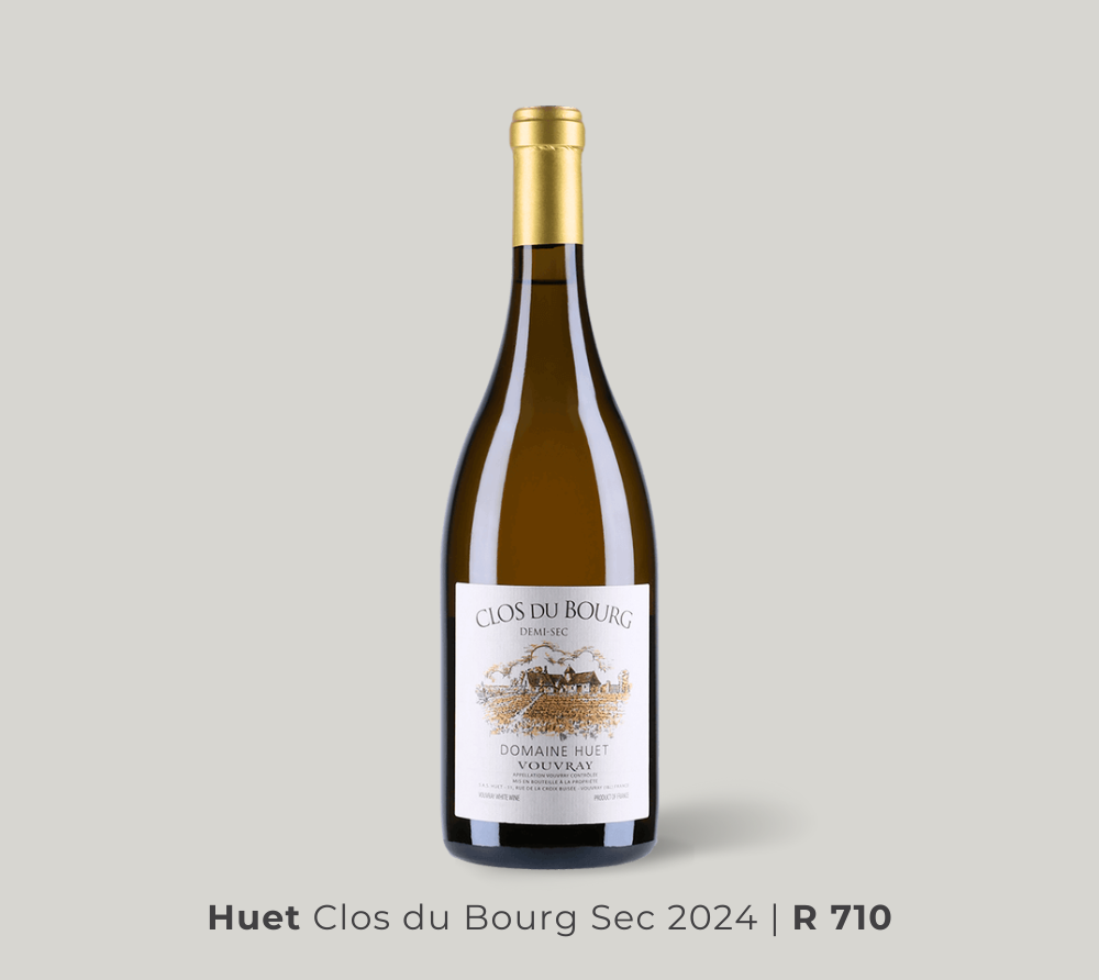 Bottle of Huet Clos du Bourg Sec 2024 white wine with gold foil top and detailed vineyard label on a light gray background.