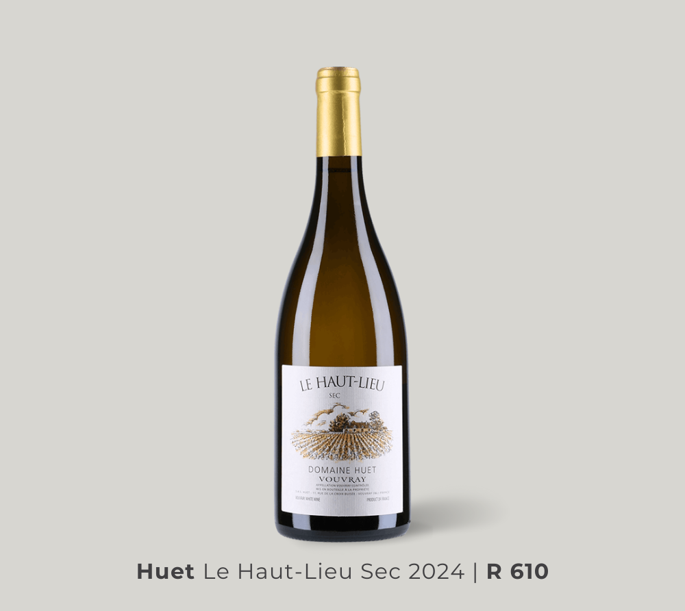 Wine bottle of Huet Le Haut-Lieu Sec 2024 white wine with gold foil and white label on a light gray background.