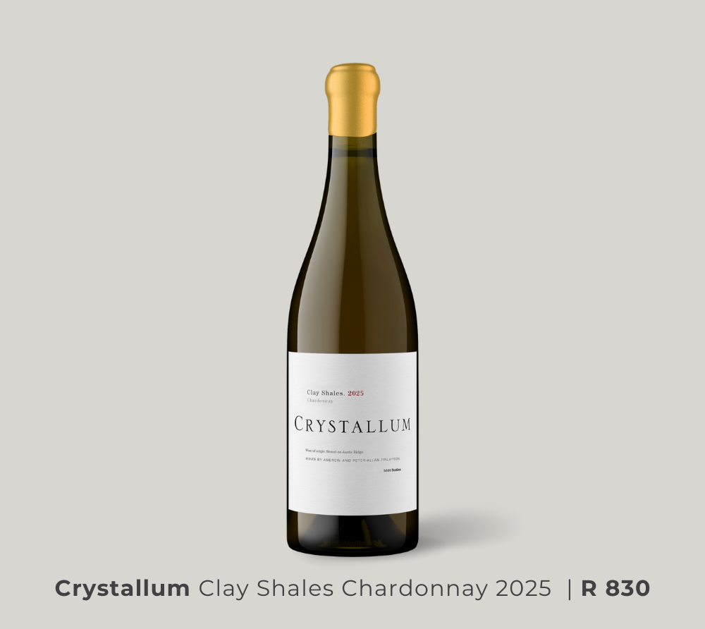 Bottle of Crystallum Clay Shales Chardonnay 2025 wine with a minimalist white label and gold foil top on a light gray background.