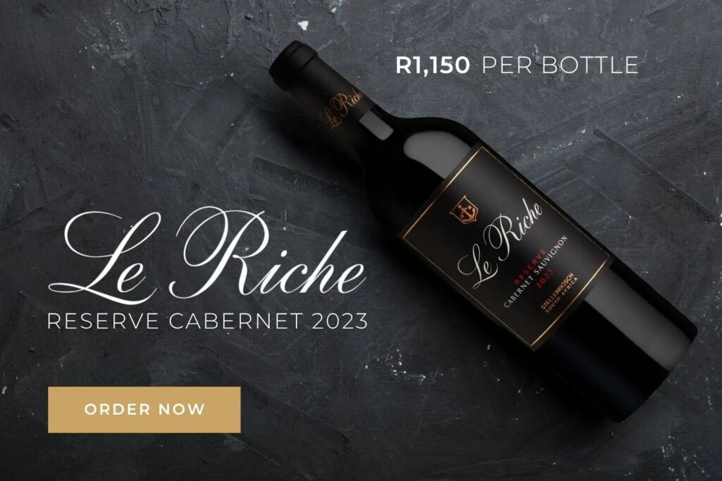 Bottle of Le Riche Reserve Cabernet 2023 wine, priced at R1,150 per bottle, with "Order Now" button on dark textured background.