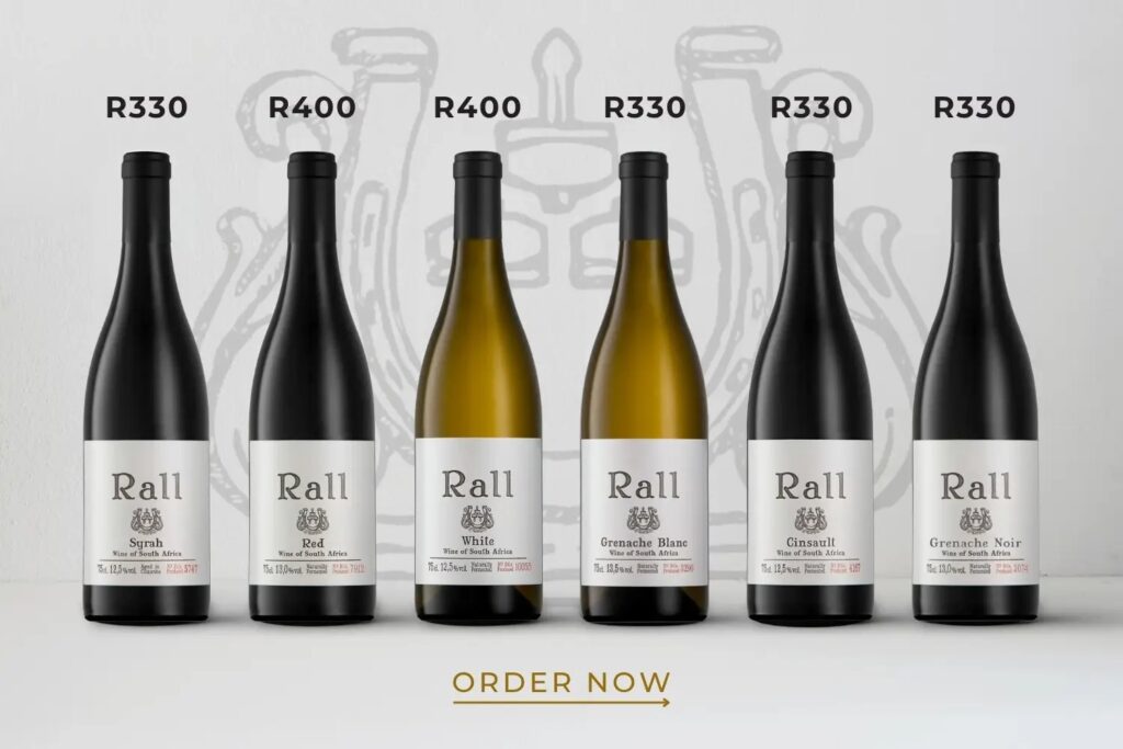 Six Rall wine bottles of different varieties with prices ranging from R330 to R400, all labeled "Wine of South Africa."